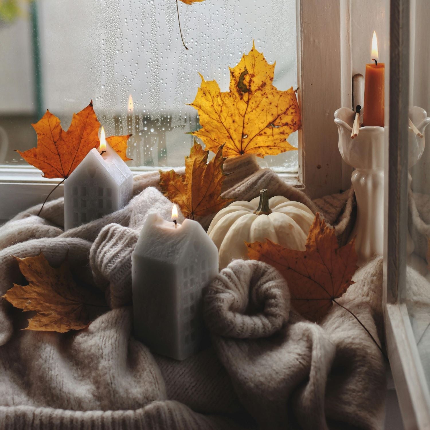 Autumn Windowsill Decoration with Candles and Pumpkin