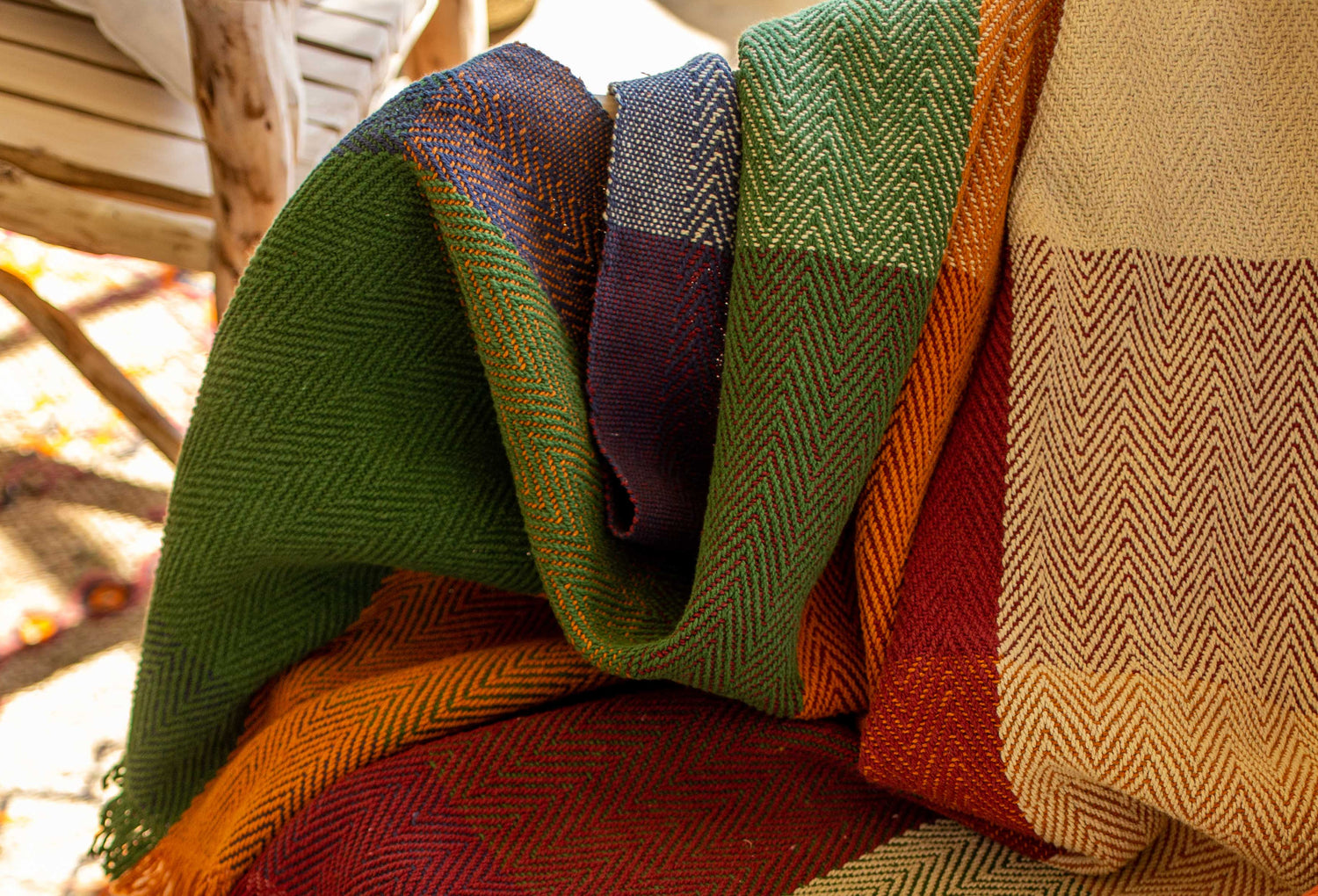 Close up of a Check Herringbone Throw on a Wooden Chair