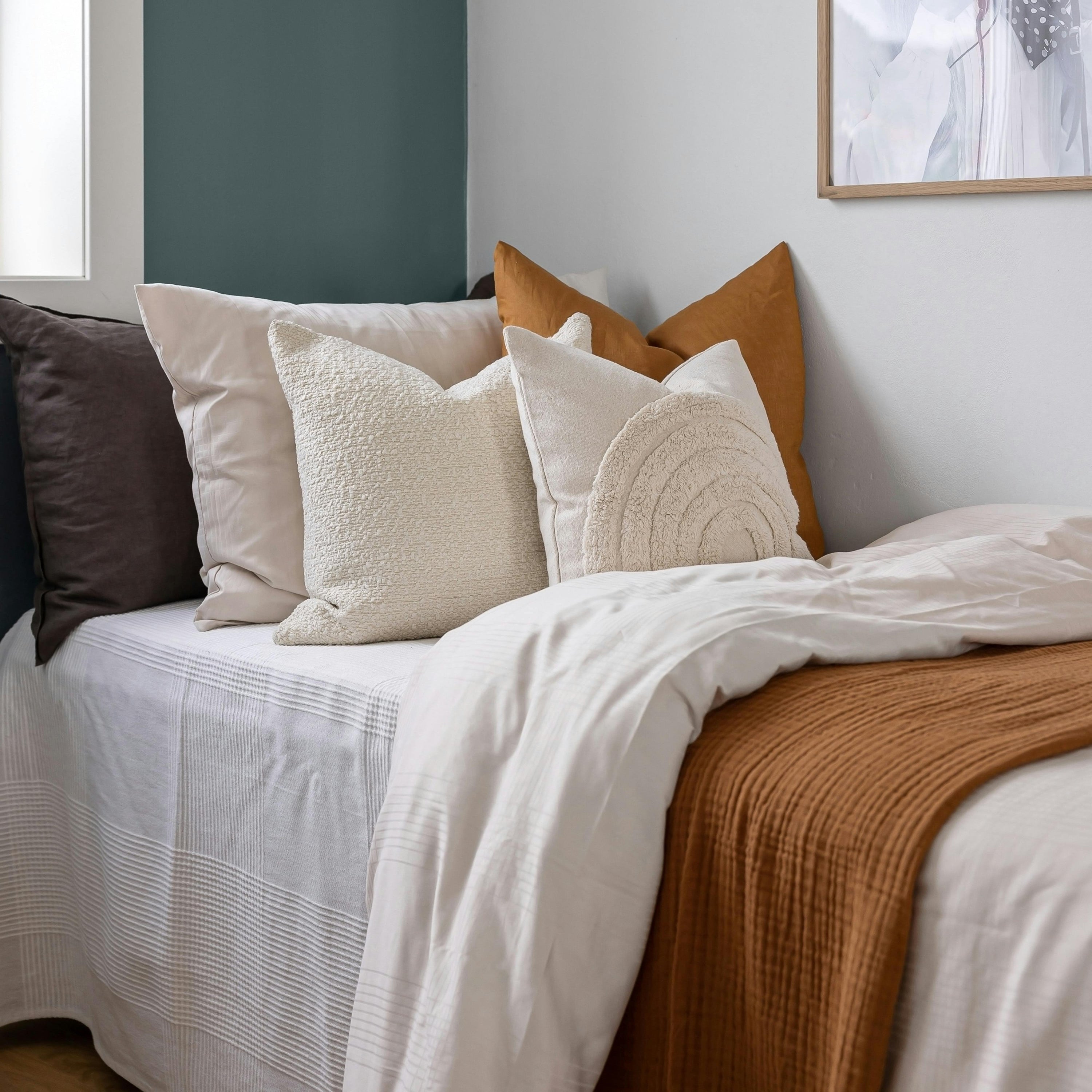 Linen bedspread in orange colour.