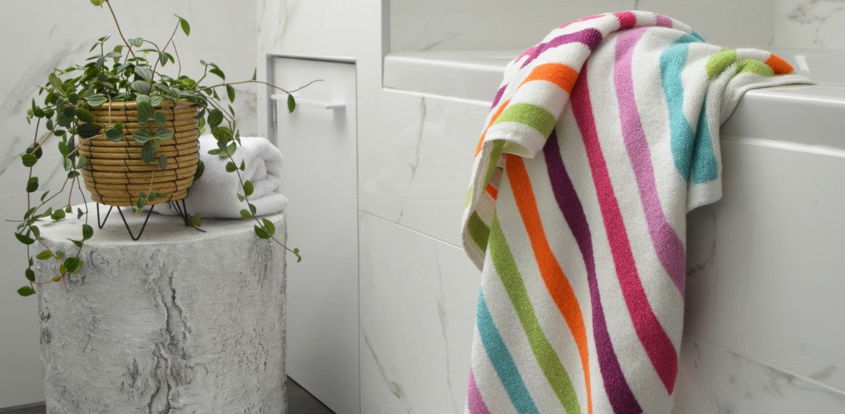 Colourful striped towels for the bathroom, rainbow design.
