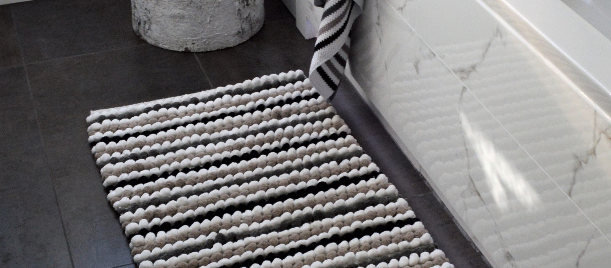 Patterned bath mats in a stripe design.