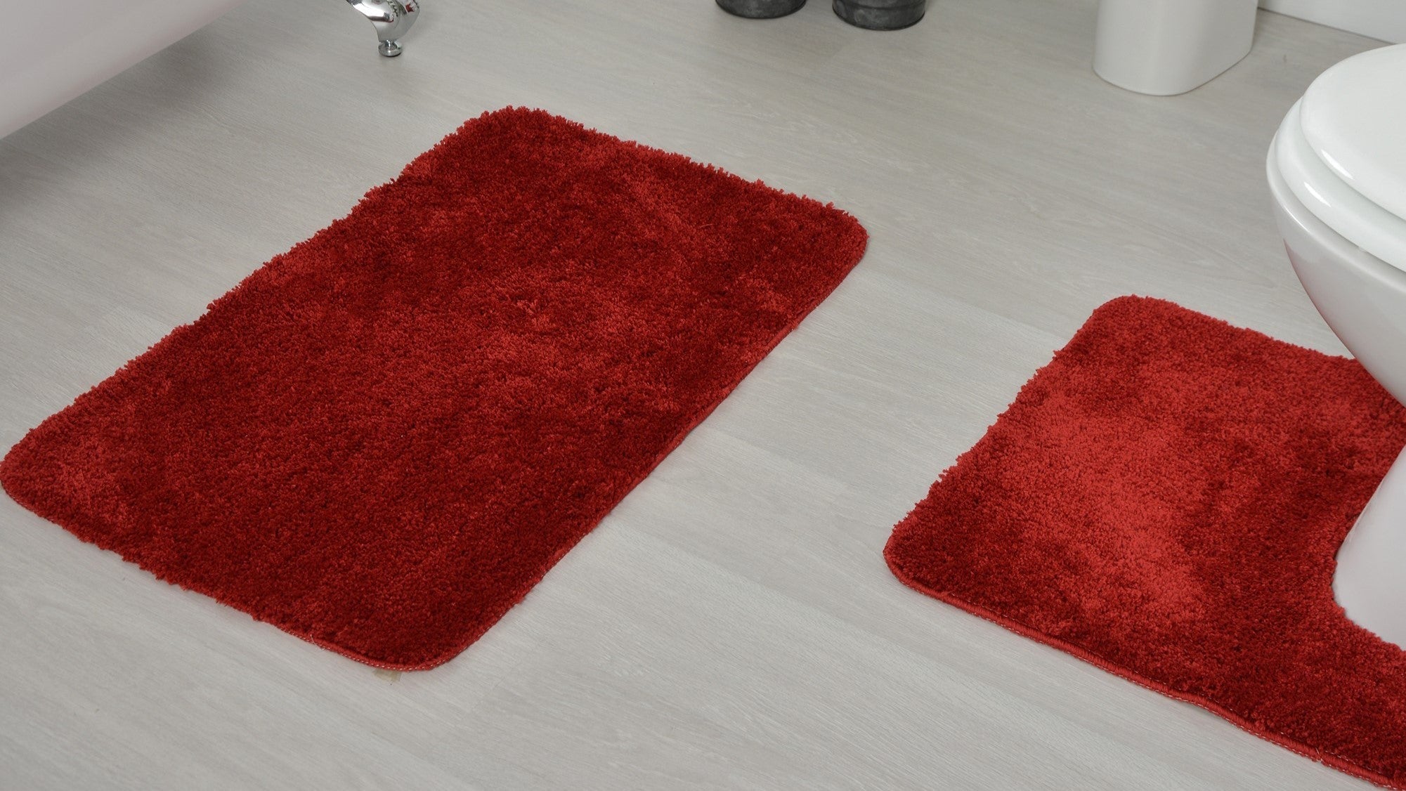Red bath mats for the bathroom - traditional rectangle mats and pedestal mats. Various shade of red bath mats - cherry, wine, burgundy.