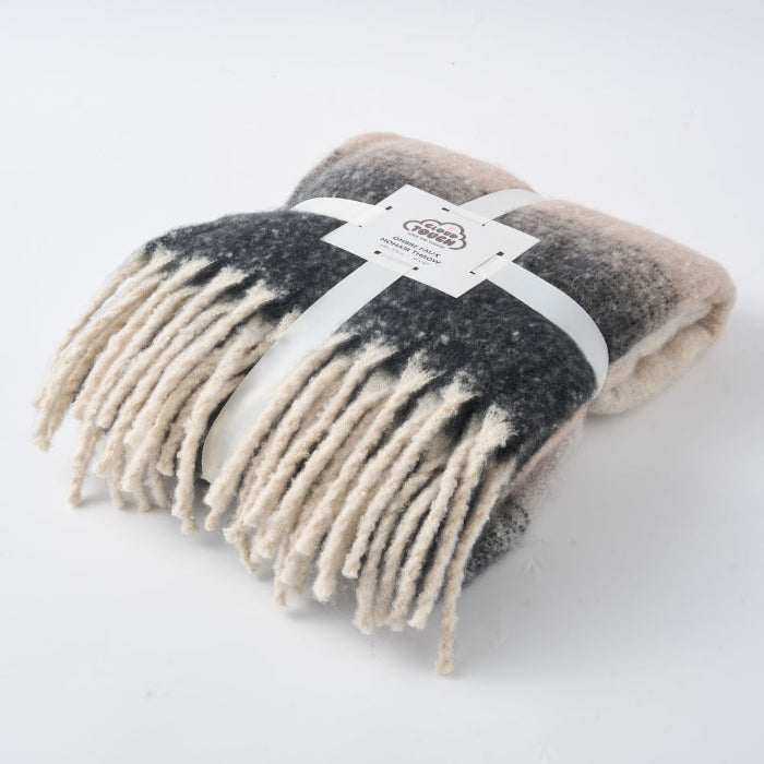 Grey and rose fringed blanket made from faux mohair.