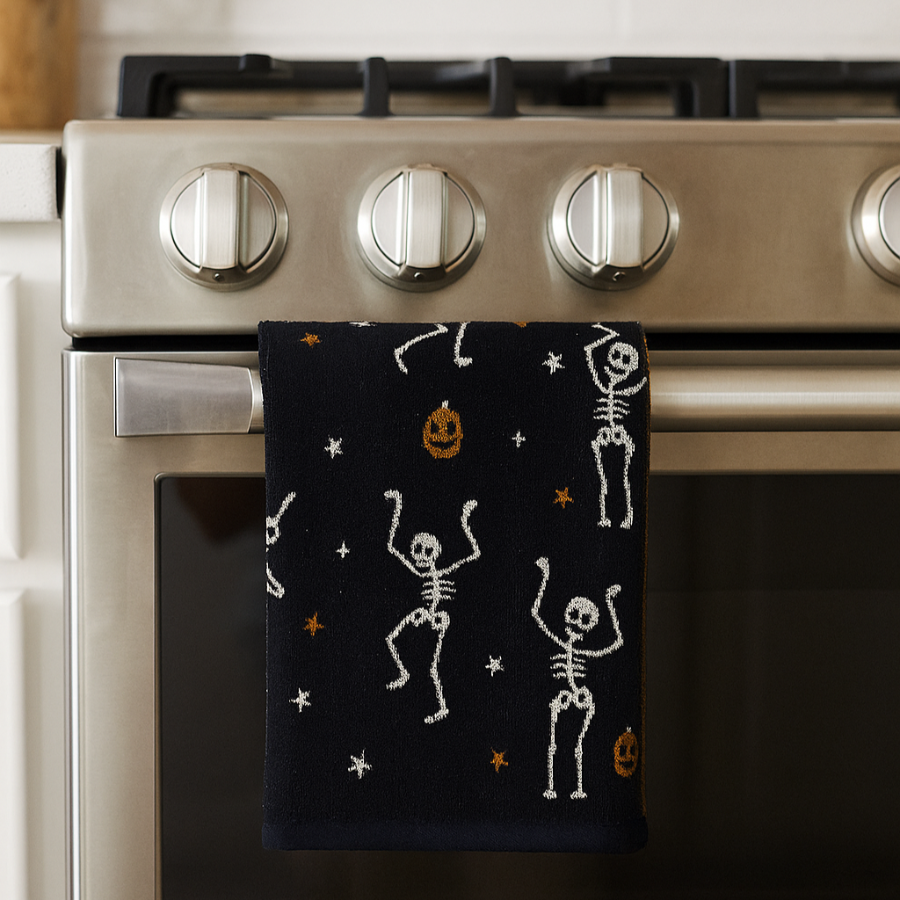 Black and white Halloween decor, cute dancing skeletons hand towels for the kitchen or bathroom.