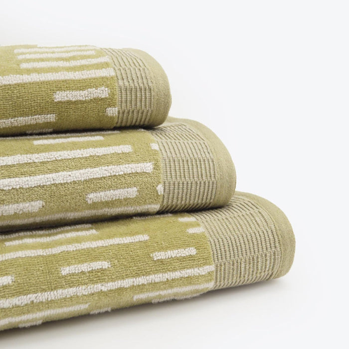 Statement towels for the bathroom in a green and white stripe pattern. Set of three - hand towel, bath towel, and bath sheet.