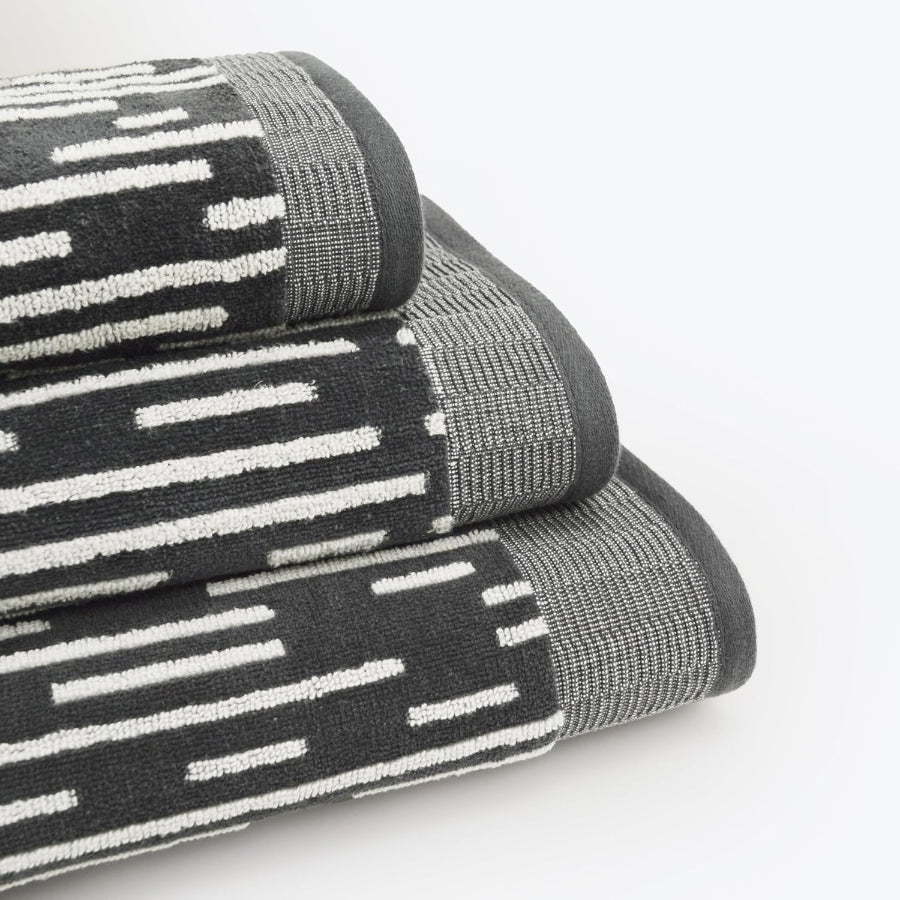 Black and white towels in a striped contrasting stripe pattern.