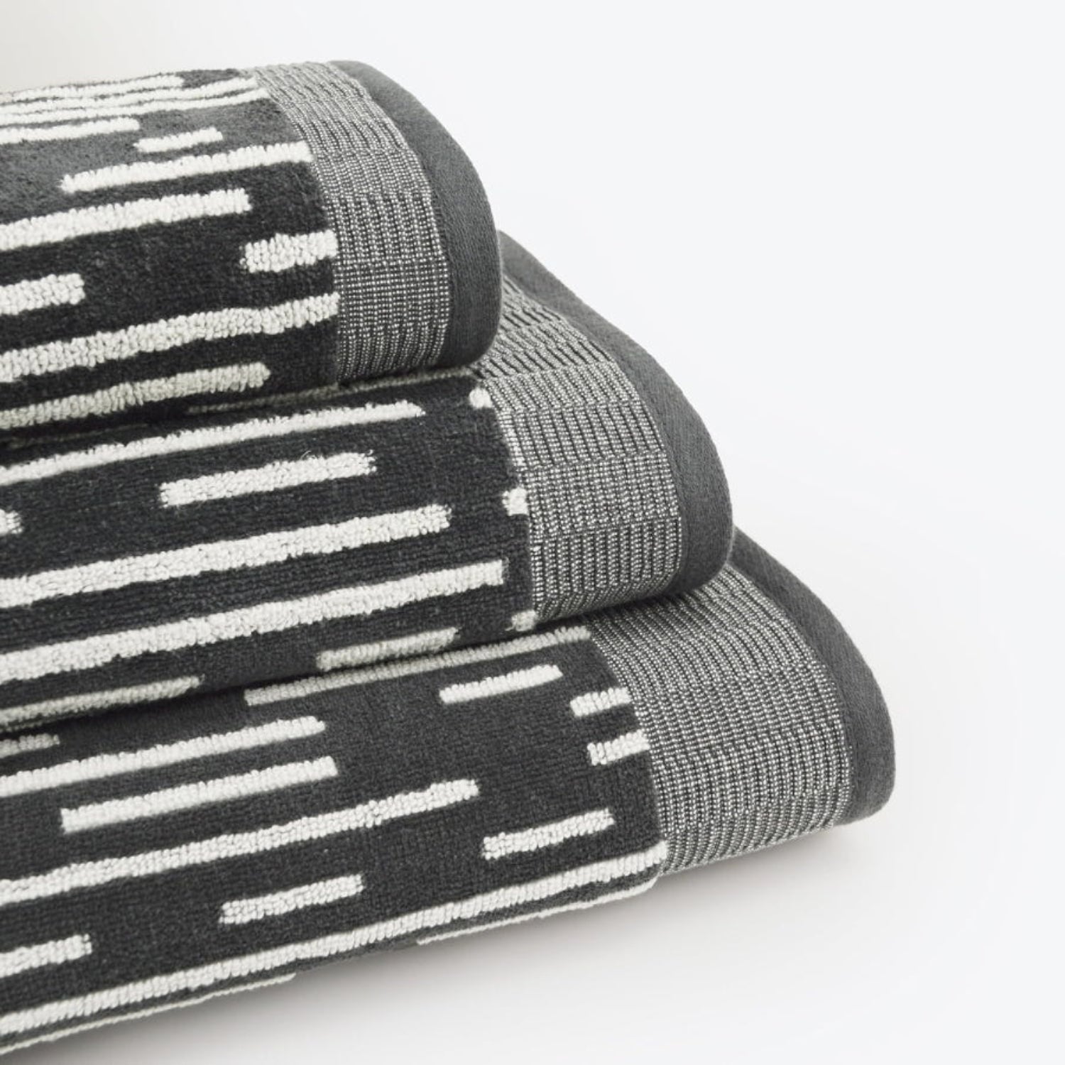 Black and white towels in a striped contrasting stripe pattern.