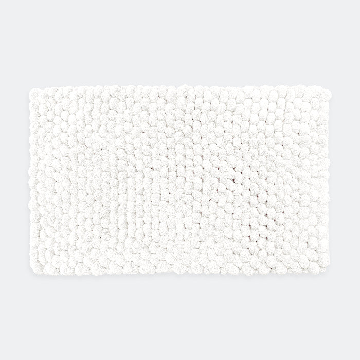 White chunky bobble bath mat in luxury thick textured design.