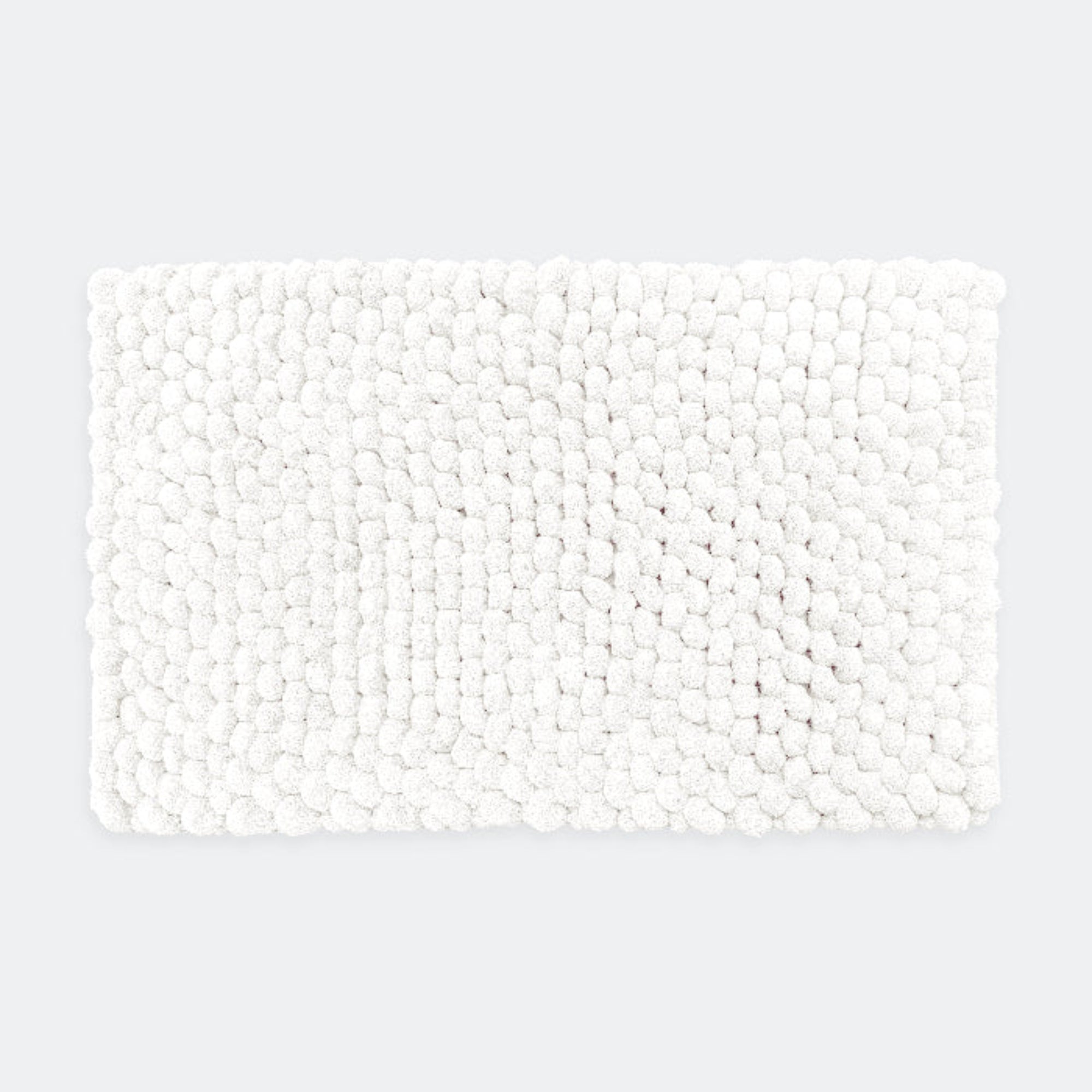White chunky bobble bath mat in luxury thick textured design.