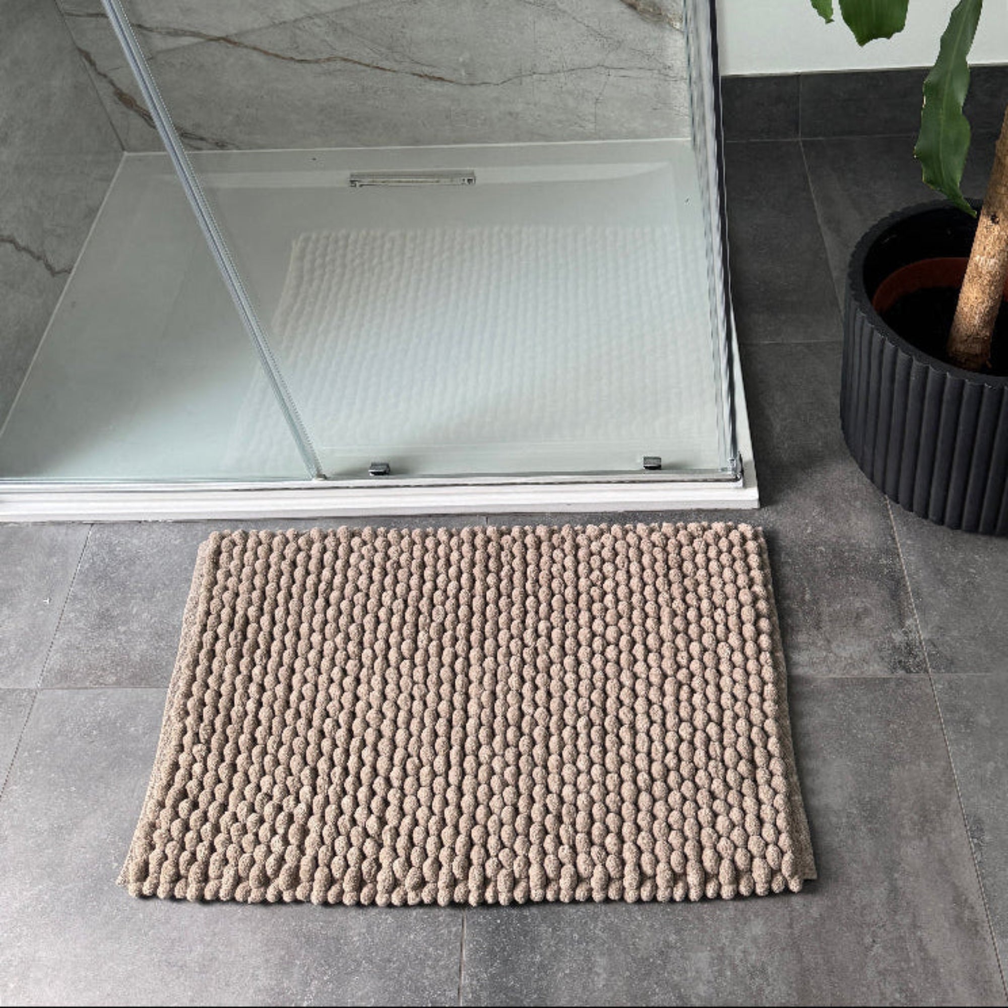 Brown bathroom rugs with thick chunky bobbles - handwoven bath mats.