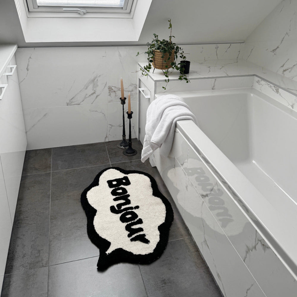 Bonjour bath mat, hand tufted slogan design.