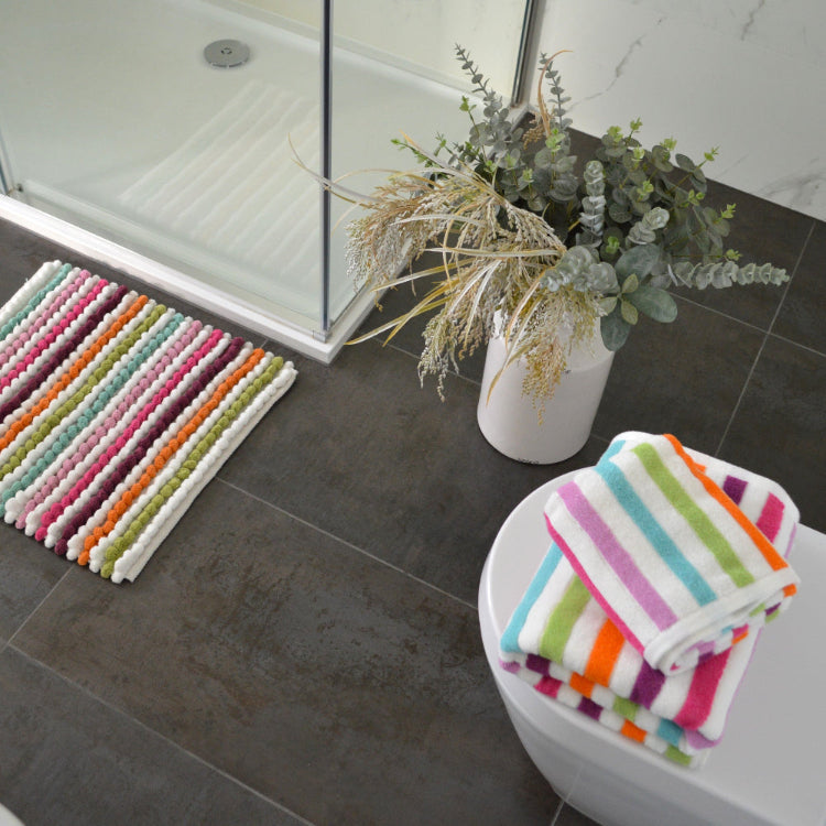 Colourful rainbow towels for the bathroom or kitchen. Striped green and pink towels.