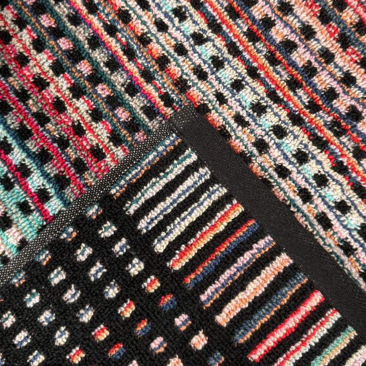 Patterned reversible towels made from recycled cotton.