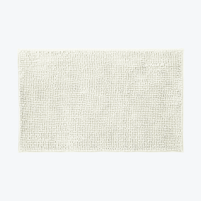 Cream chenille bobble bath mats with non slip backing.