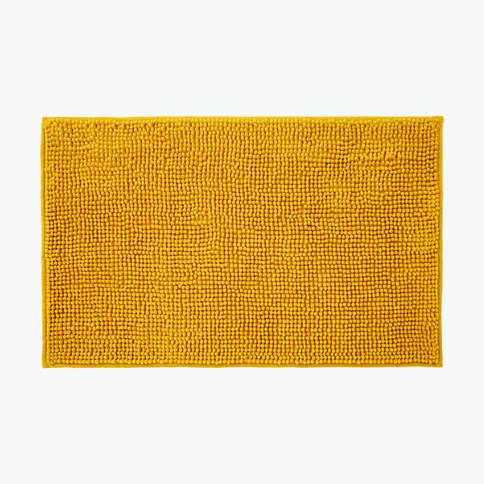 Mustard yellow chenille bobble bath mats with non slip back.