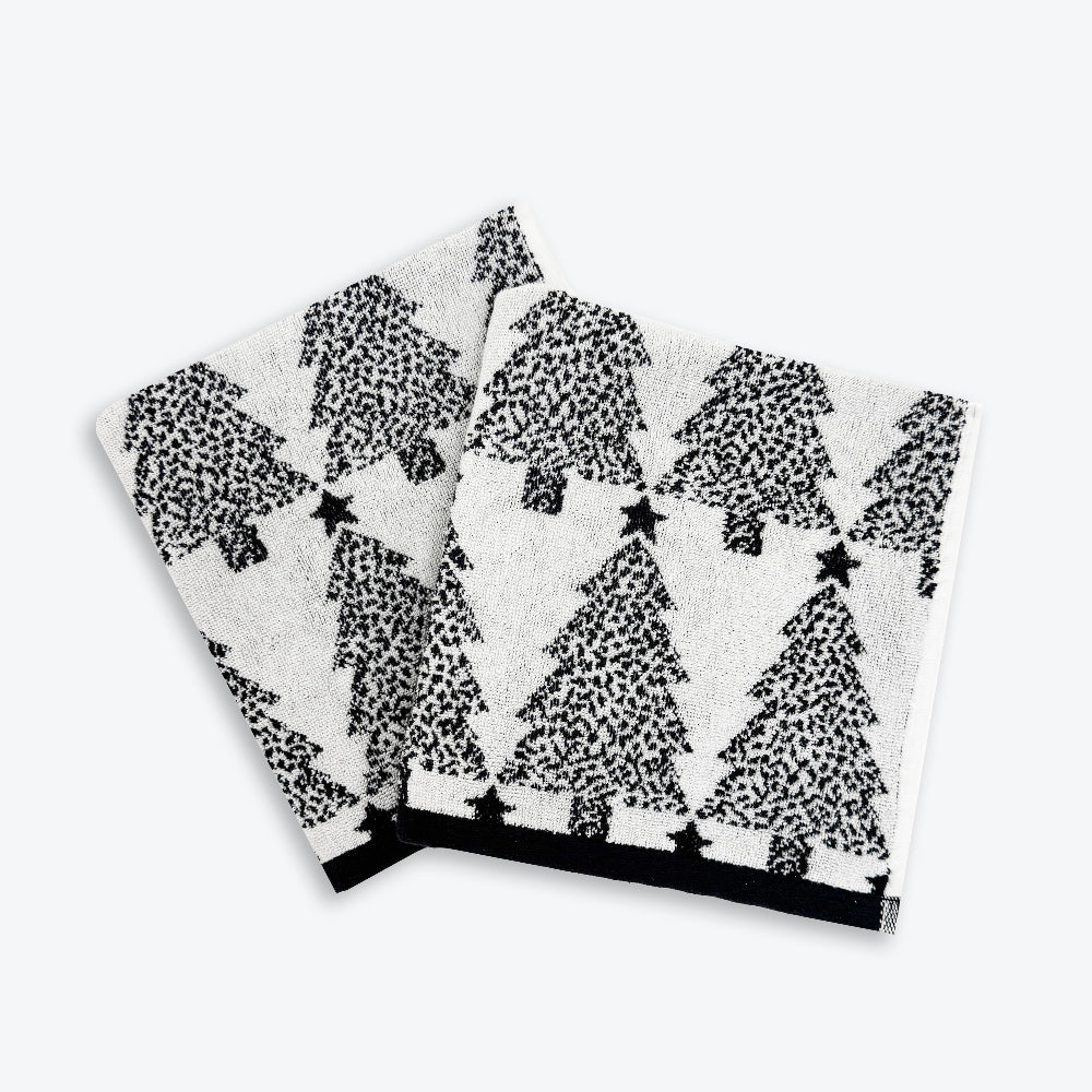 Set of black and white Christmas hand towels with Christmas trees pattern. Modern and sophisticated decor for Christmas.