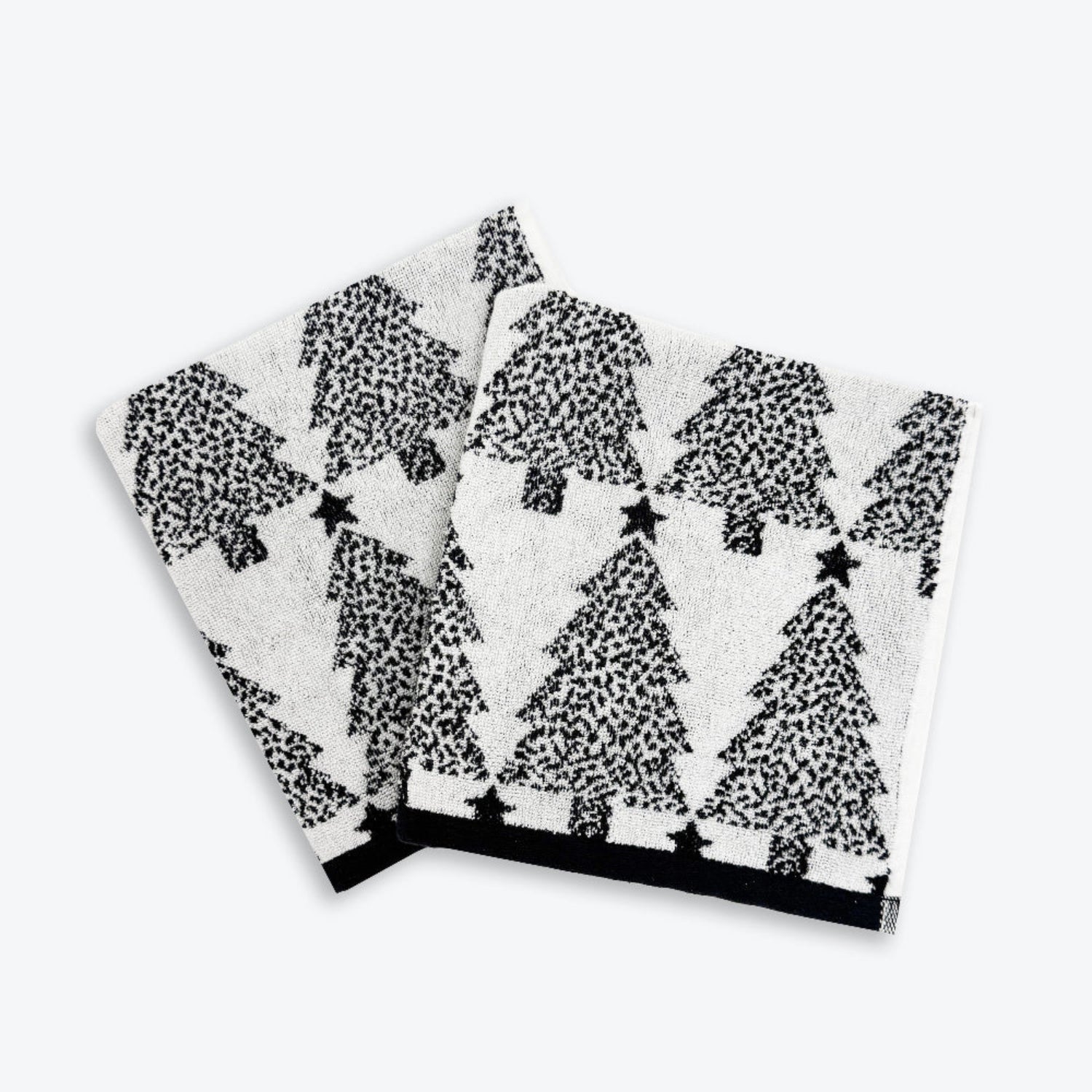 Set of black and white Christmas hand towels with Christmas trees pattern. Modern and sophisticated decor for Christmas.