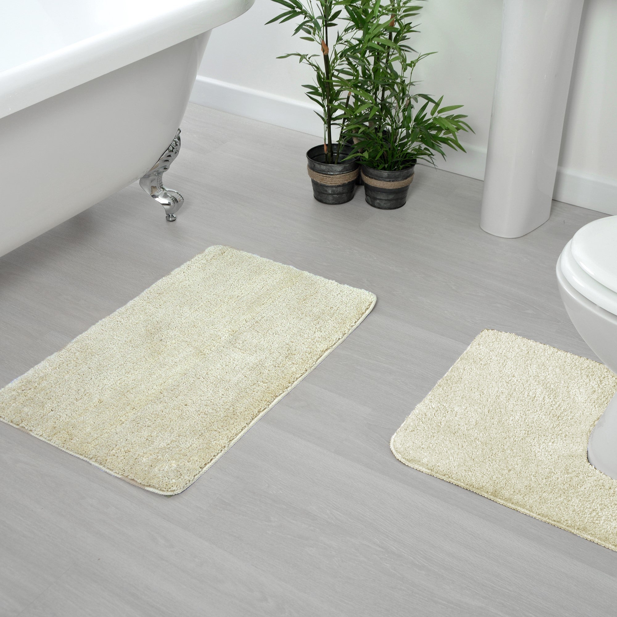 Cream non slip bath mat and pedestal mat set.