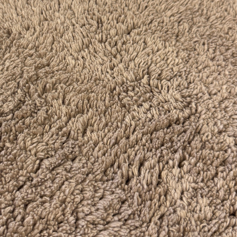 Close up of brown cotton bath mat.
