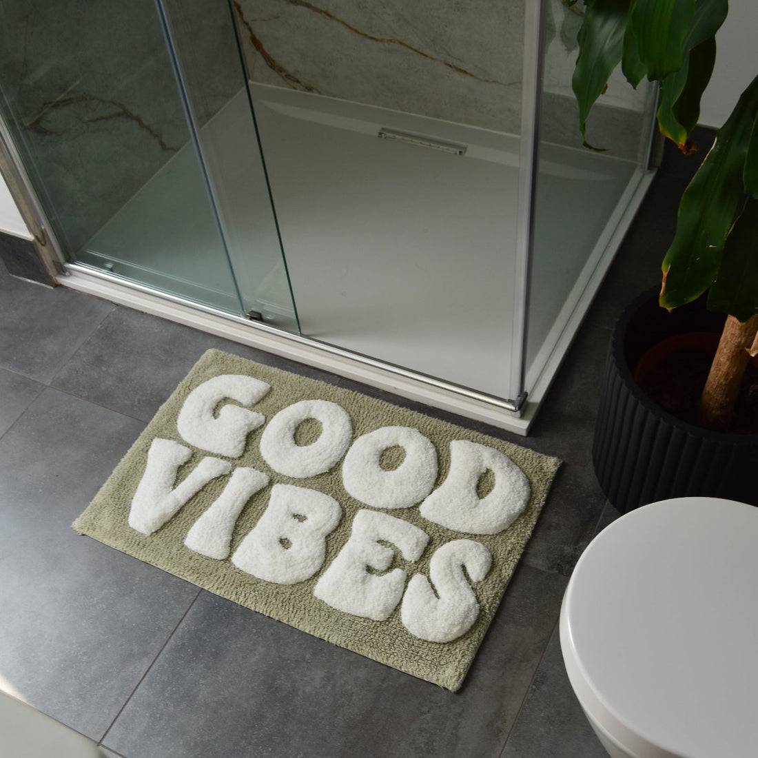 Sage green slogan bath mat with good vibes text. Fun retro bath mat to make a statement.