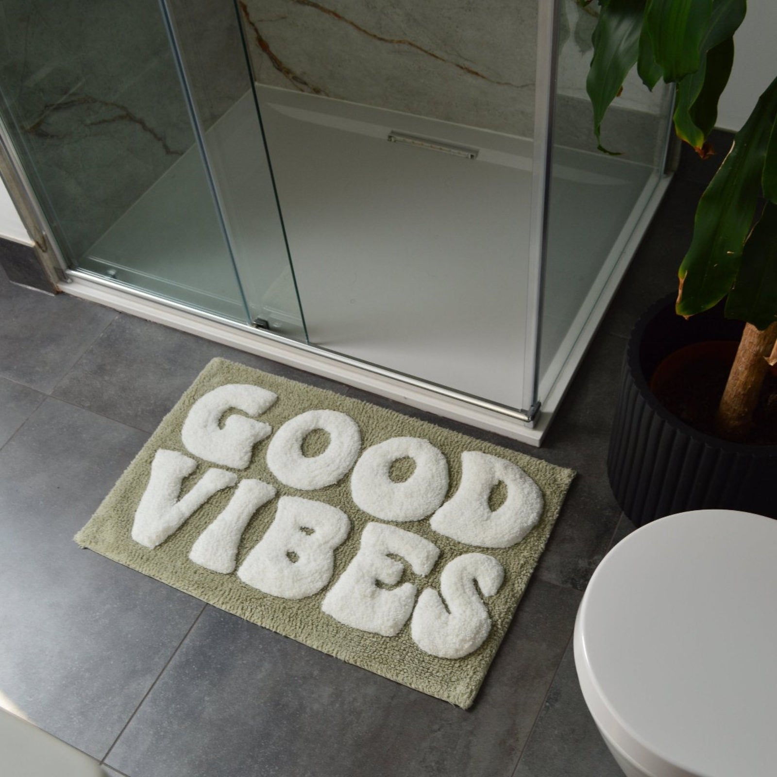 Sage green slogan bath mat with good vibes text. Fun retro bath mat to make a statement.