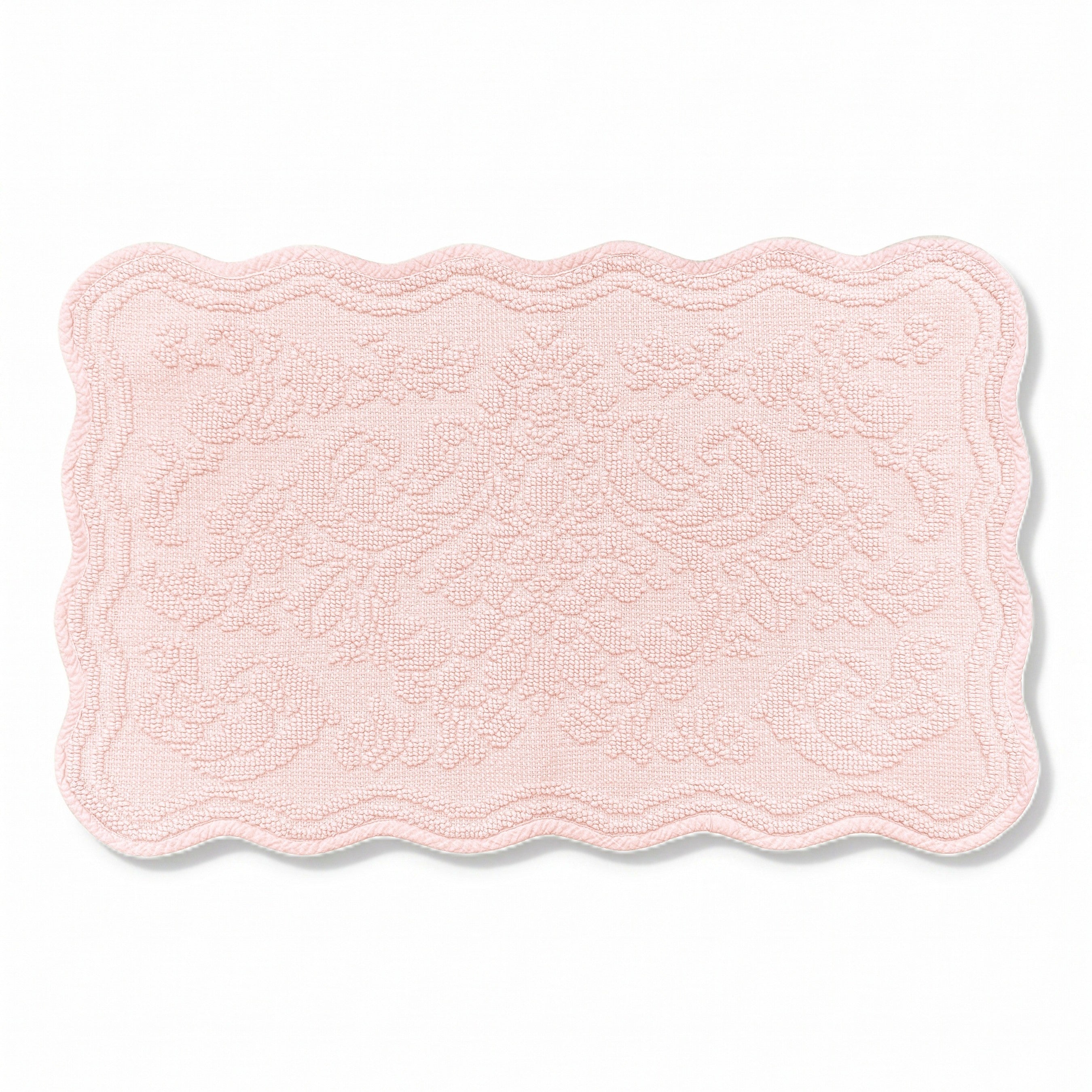 Scalloped bath mat in blush pink colour, with floral texture design - made from 100% cotton.