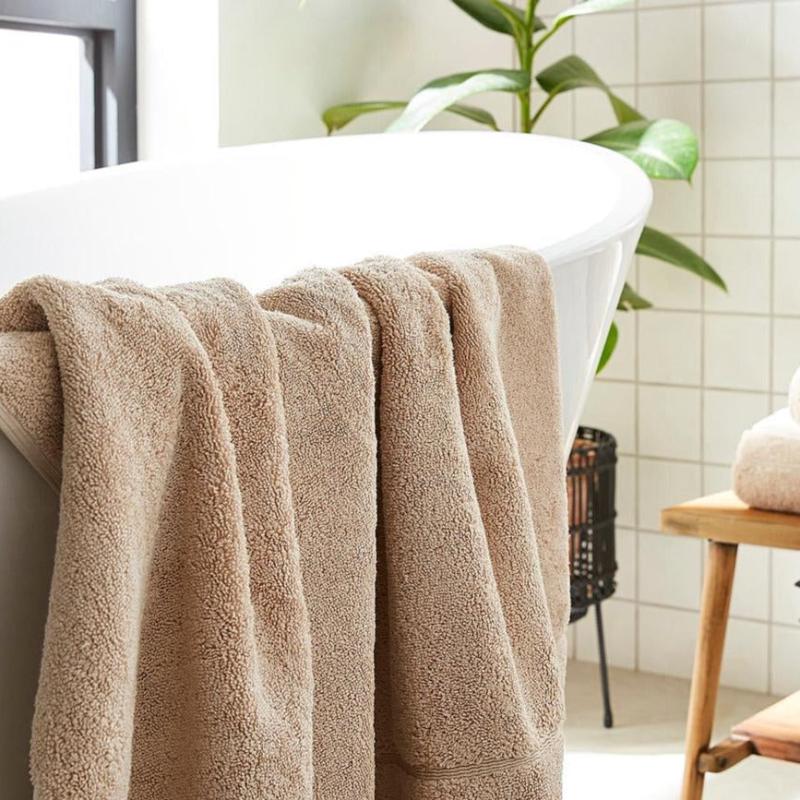Stone neutral coloured hotel luxury bath towels made from 100% cotton.