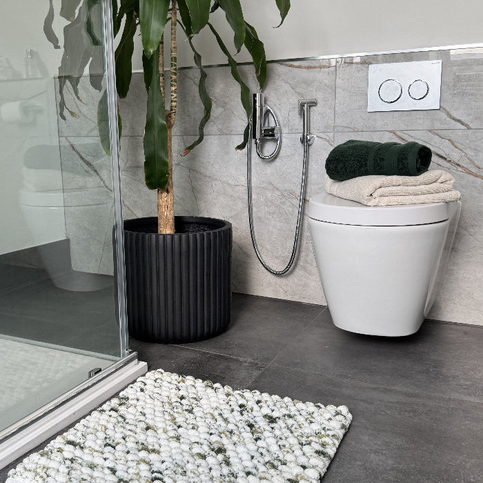 Matching coloured towels for bath mats.