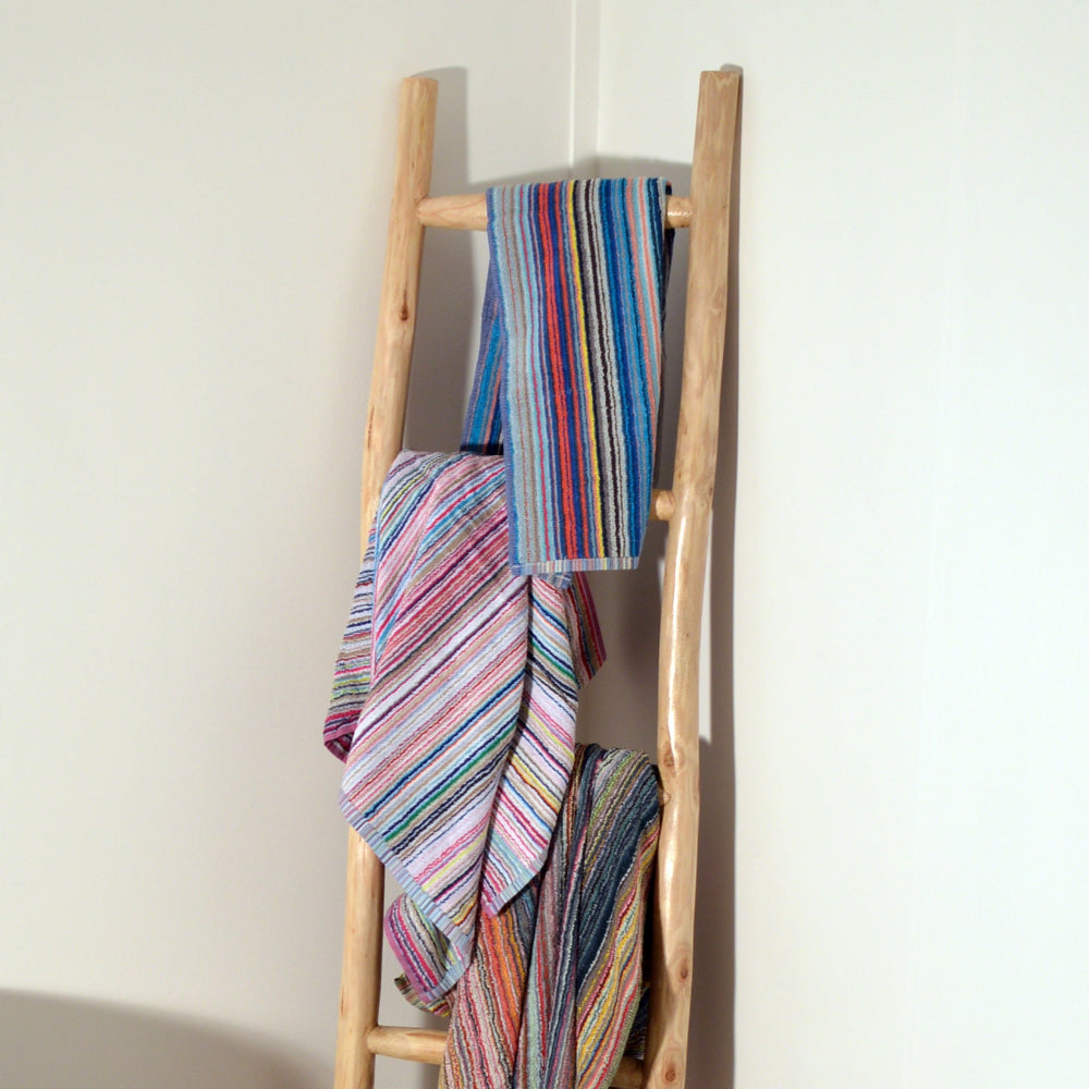 Striped sustainable towels made from remnant yarns.