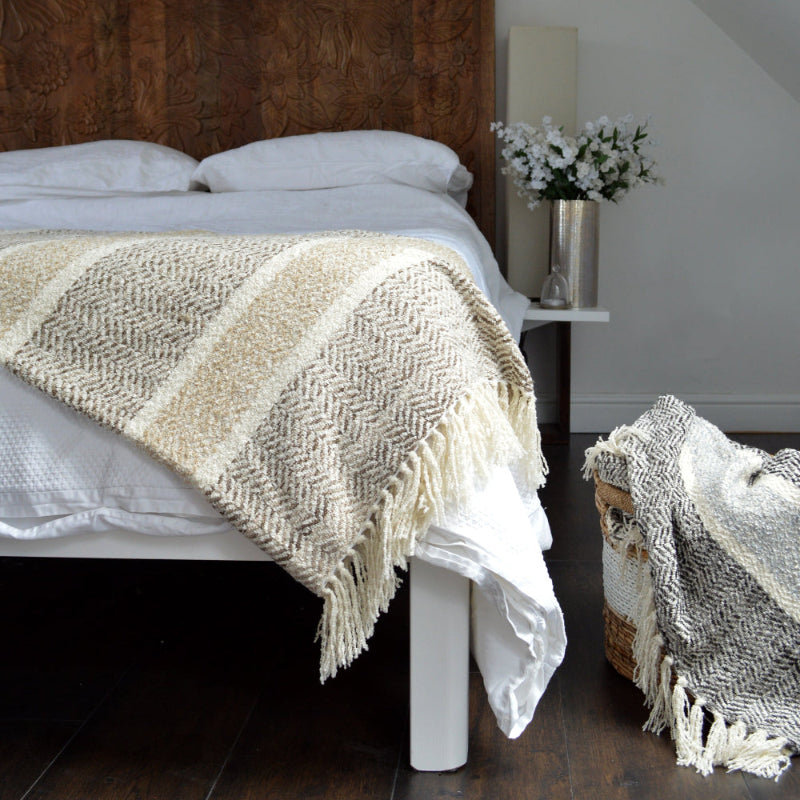 Patterned throw with fringe.