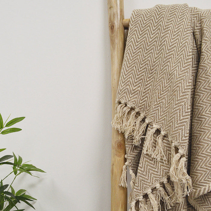 Herringbone beige throw blanket with fringe accent