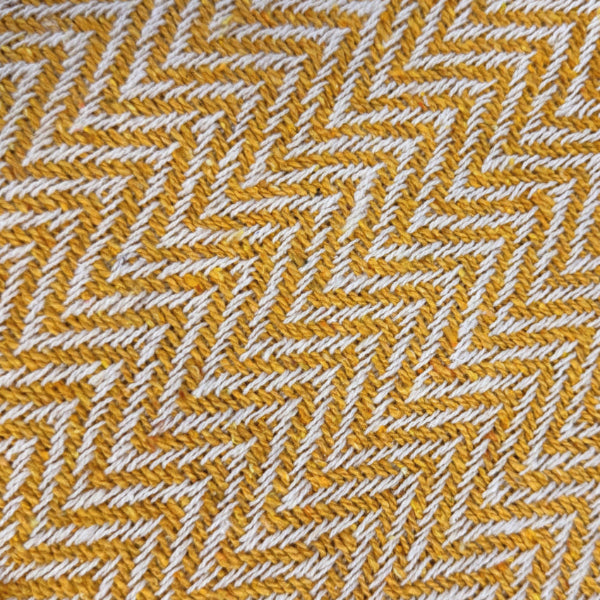 Mustard herringbone chevron throw made from cotton.