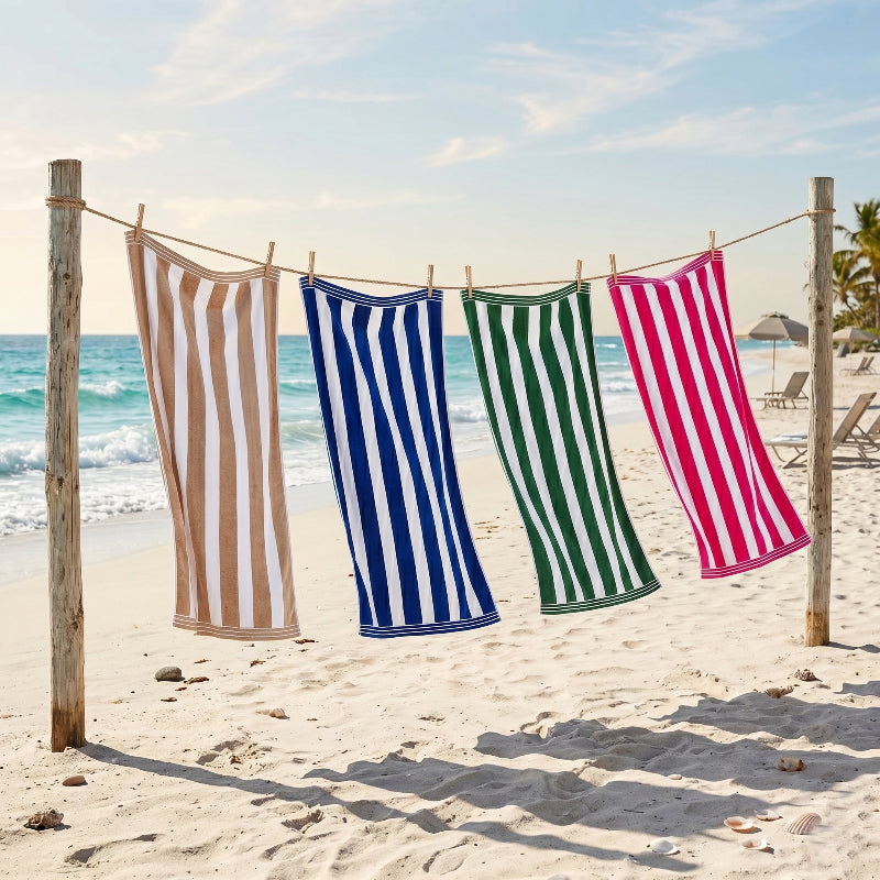 Large striped beach towels in statement colours.