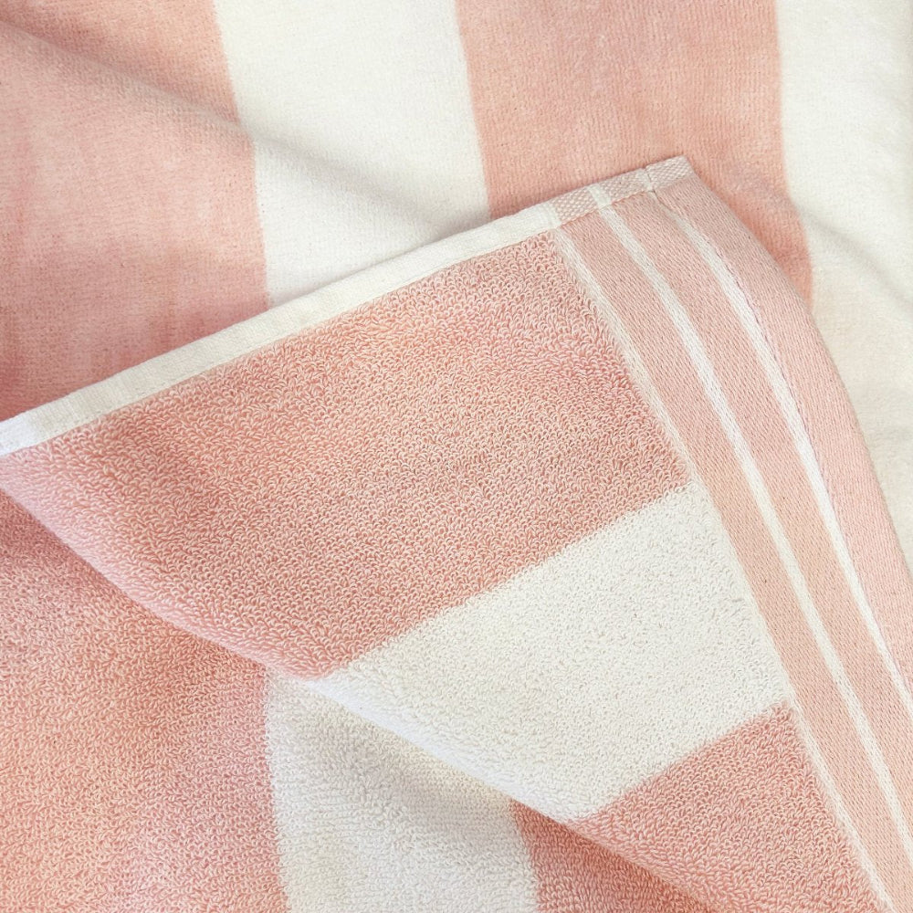 Baby pink beach towel, striped cabana design