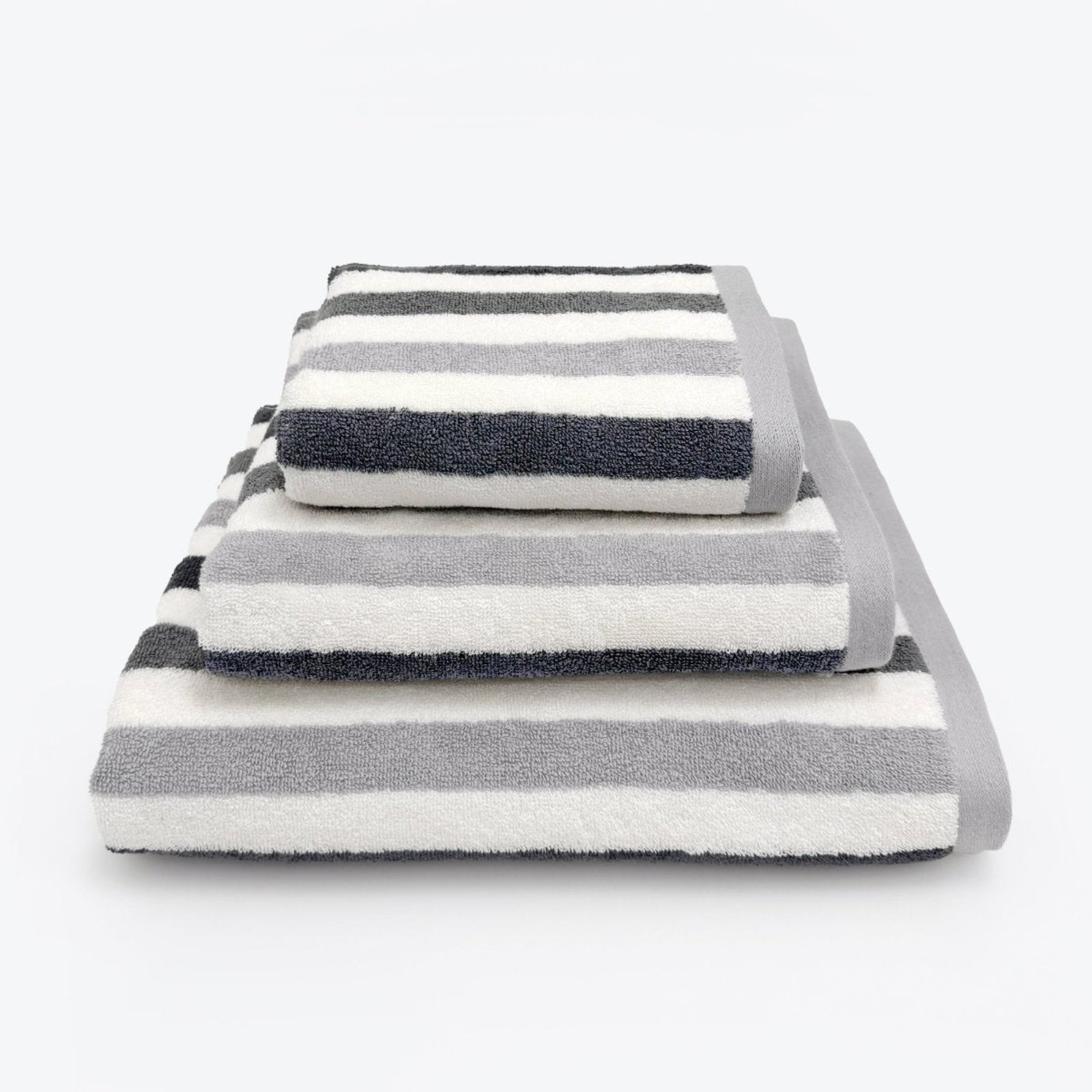 Grey striped bathroom towels set. Patterned towels in three sizes: Hand towel, bath towel and bath sheet.