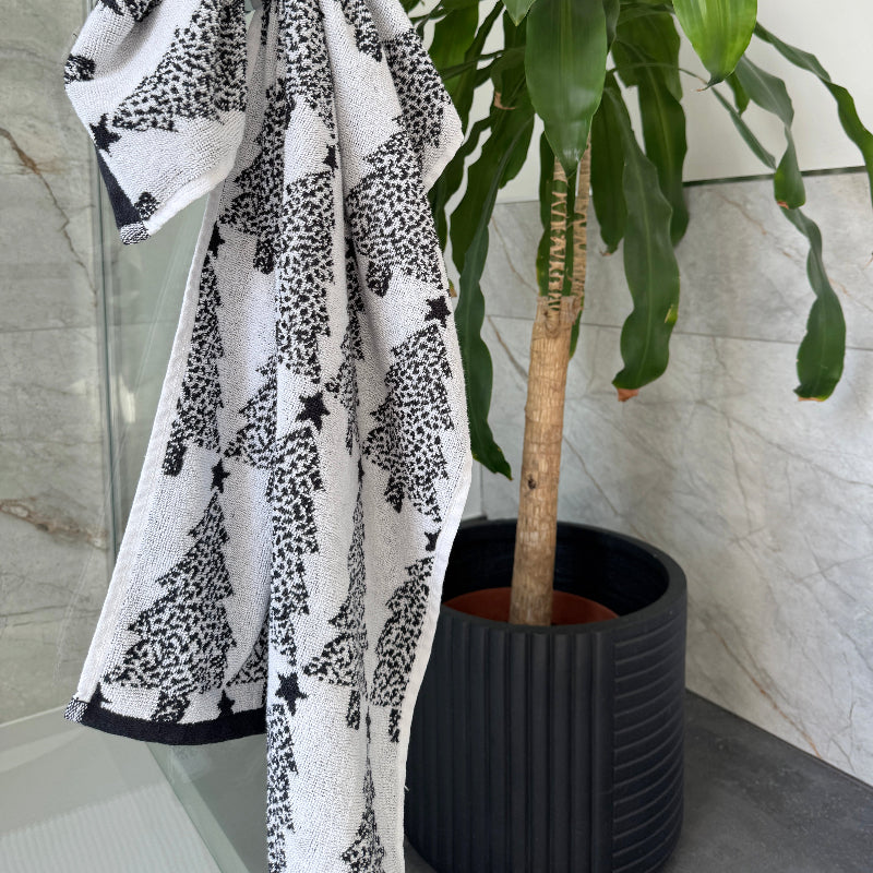 White and black Christmas tree towels for the bathroom or kitchen.