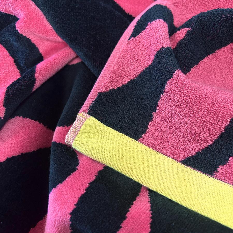 Pink and black zebra print, statement beach towel, made from 100% cotton.