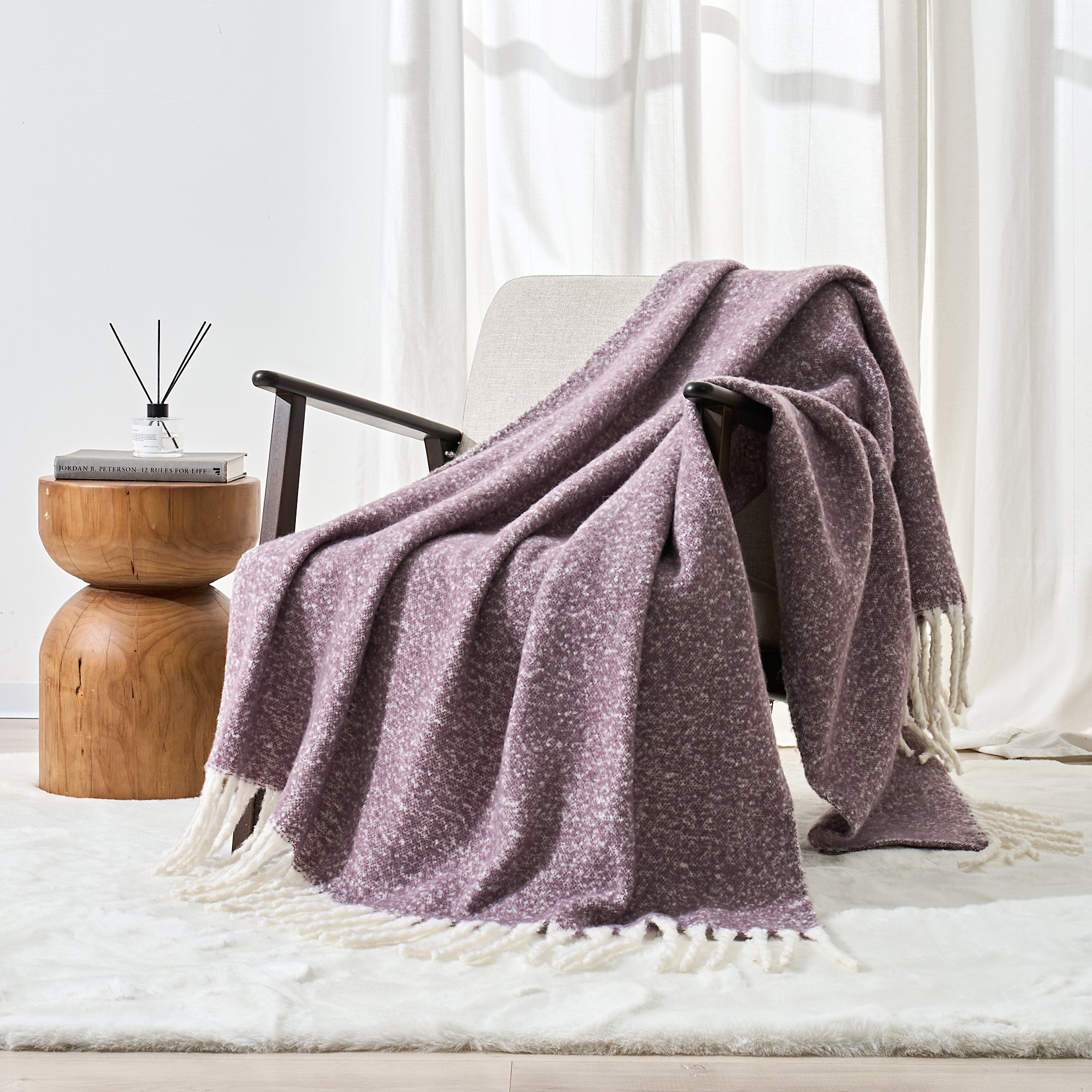 faux mohair throw thistle purple over a chair