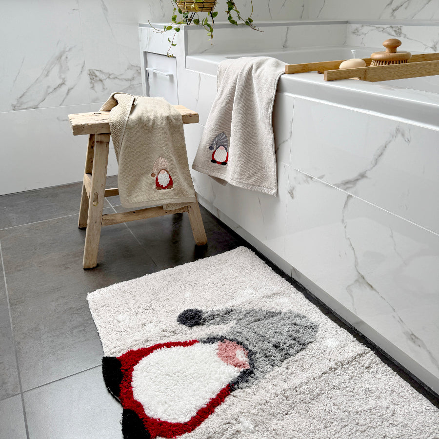 Novelty towels for a Christmas bathroom with a fun gink gnome design.