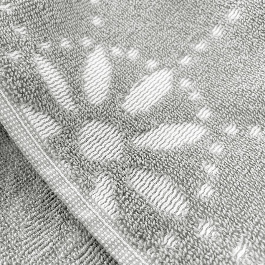 grey white floral patterned towels