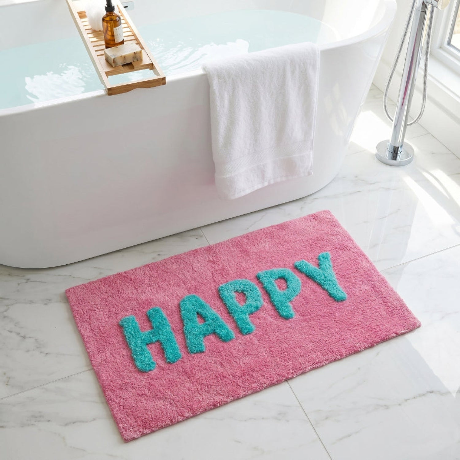 Pink bath mat with &