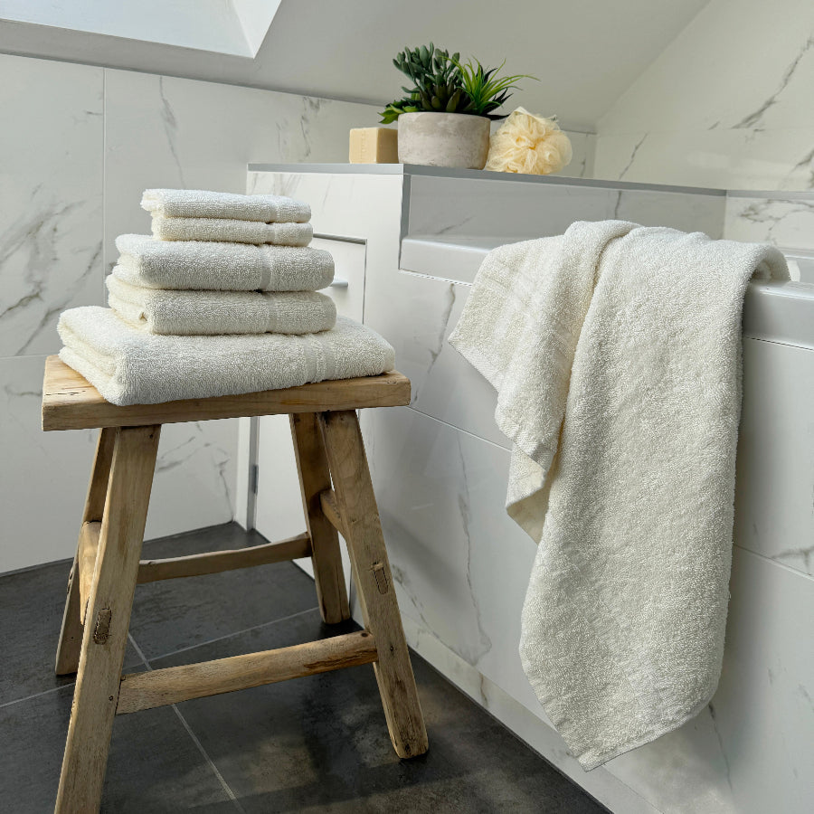 Cream set of towels for the bathroom - mixed sizes: hand towel, bath towel and face cloths.