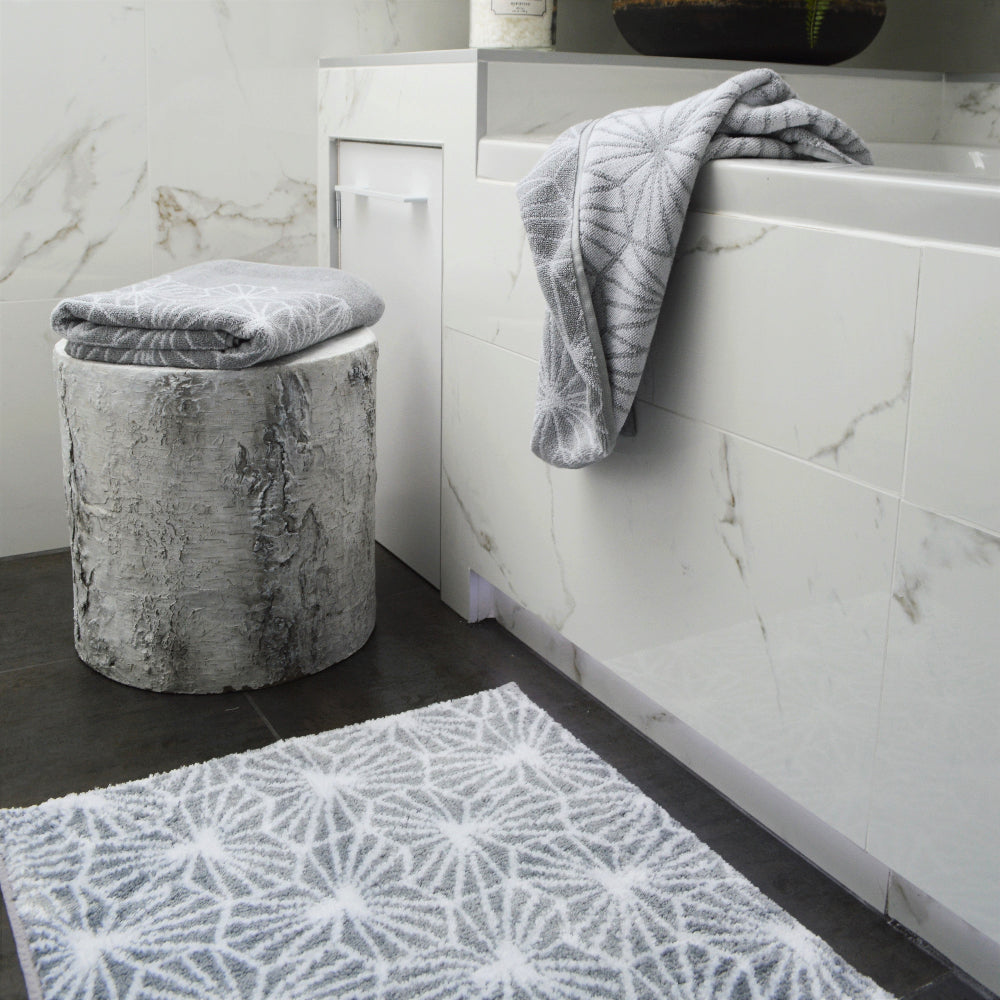 Grey non slip patterned bath mat, geometric print.