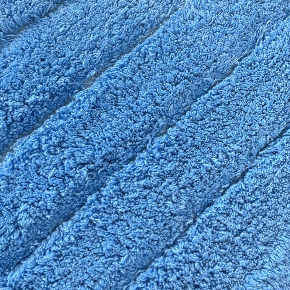 Striped ribbed blue bathroom mats