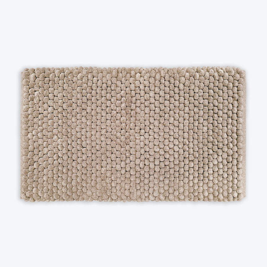 Neutral brown thick bath mat with luxury bobble texture. Super soft and absorbent washable rug.