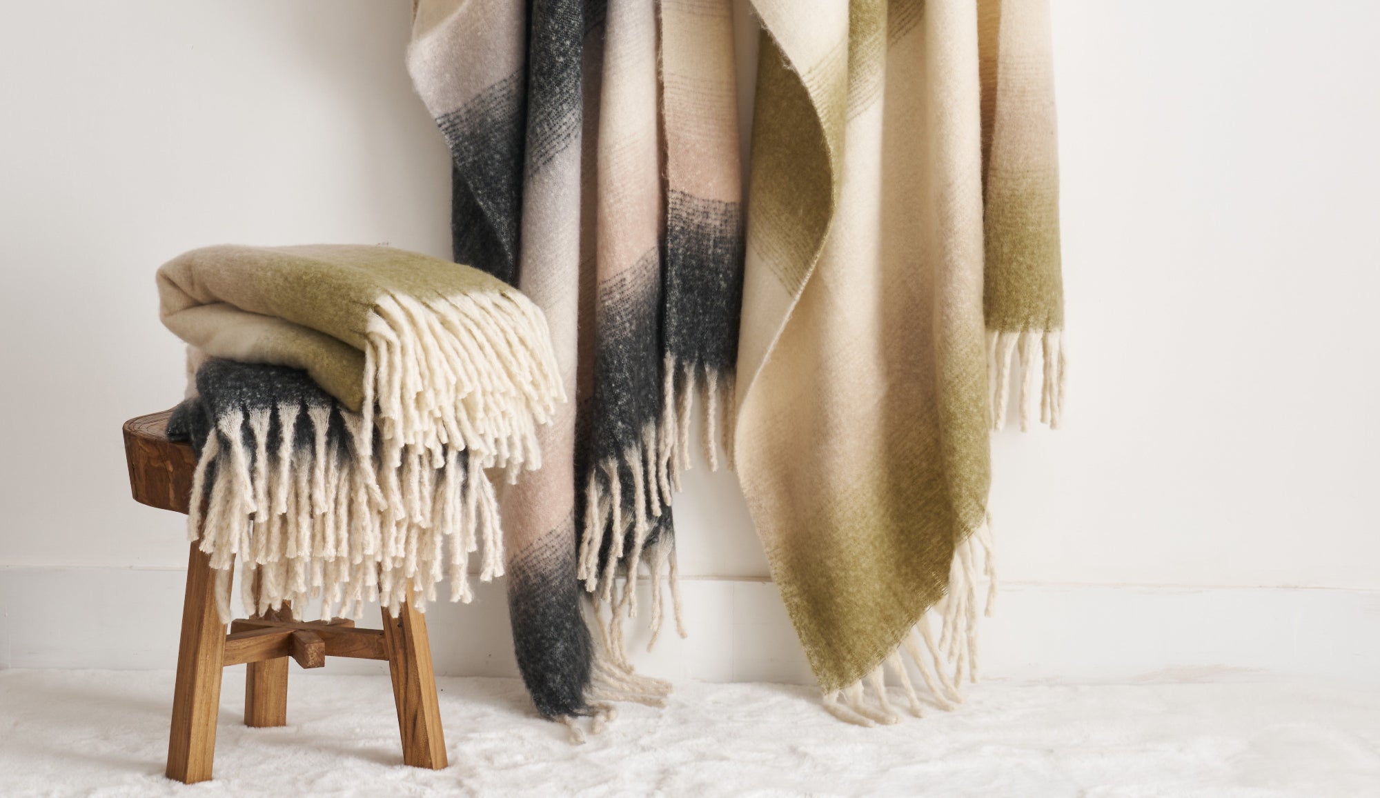 Faux mohair throw blankets in ombre green and charcoal