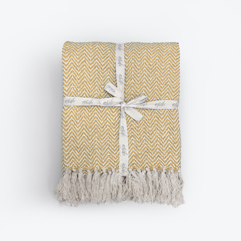Mustard yellow throw blanket for the bedroom or sofa. 100% cotton throw in herringbone pattern.