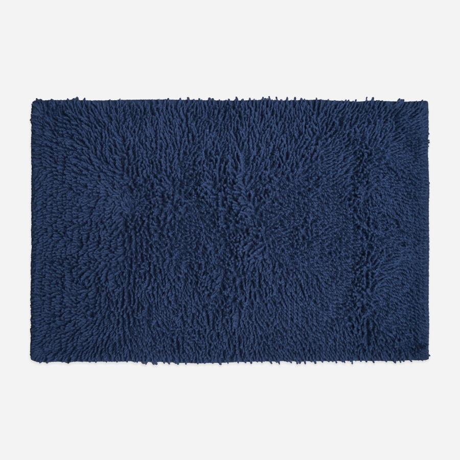 Navy blue cotton bath mat, tumble twist design.