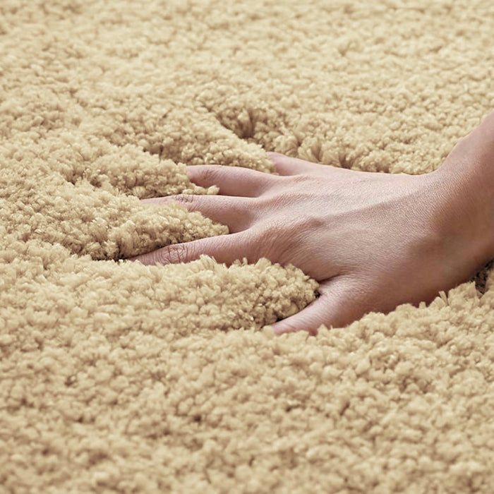 Beige microfibre bath mat with non slip backing.