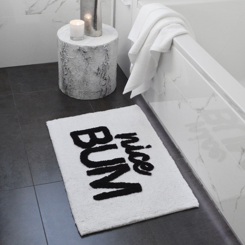 Nice bum slogan bath mat. Monochrome, white and black rug for the bathroom.